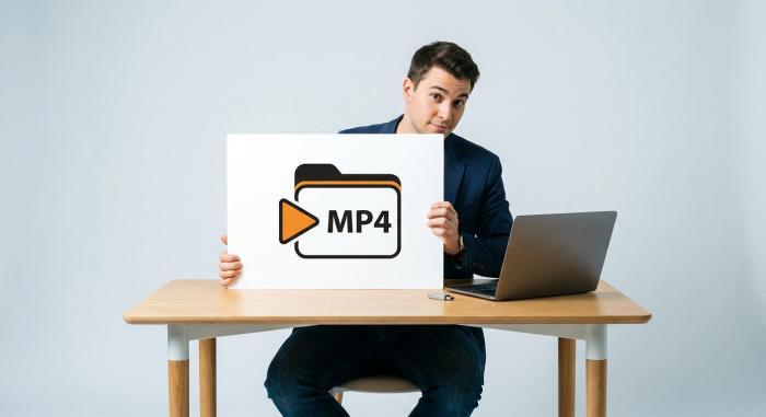 Man at desk with laptop and USB drive, contemplating Netflix content download options